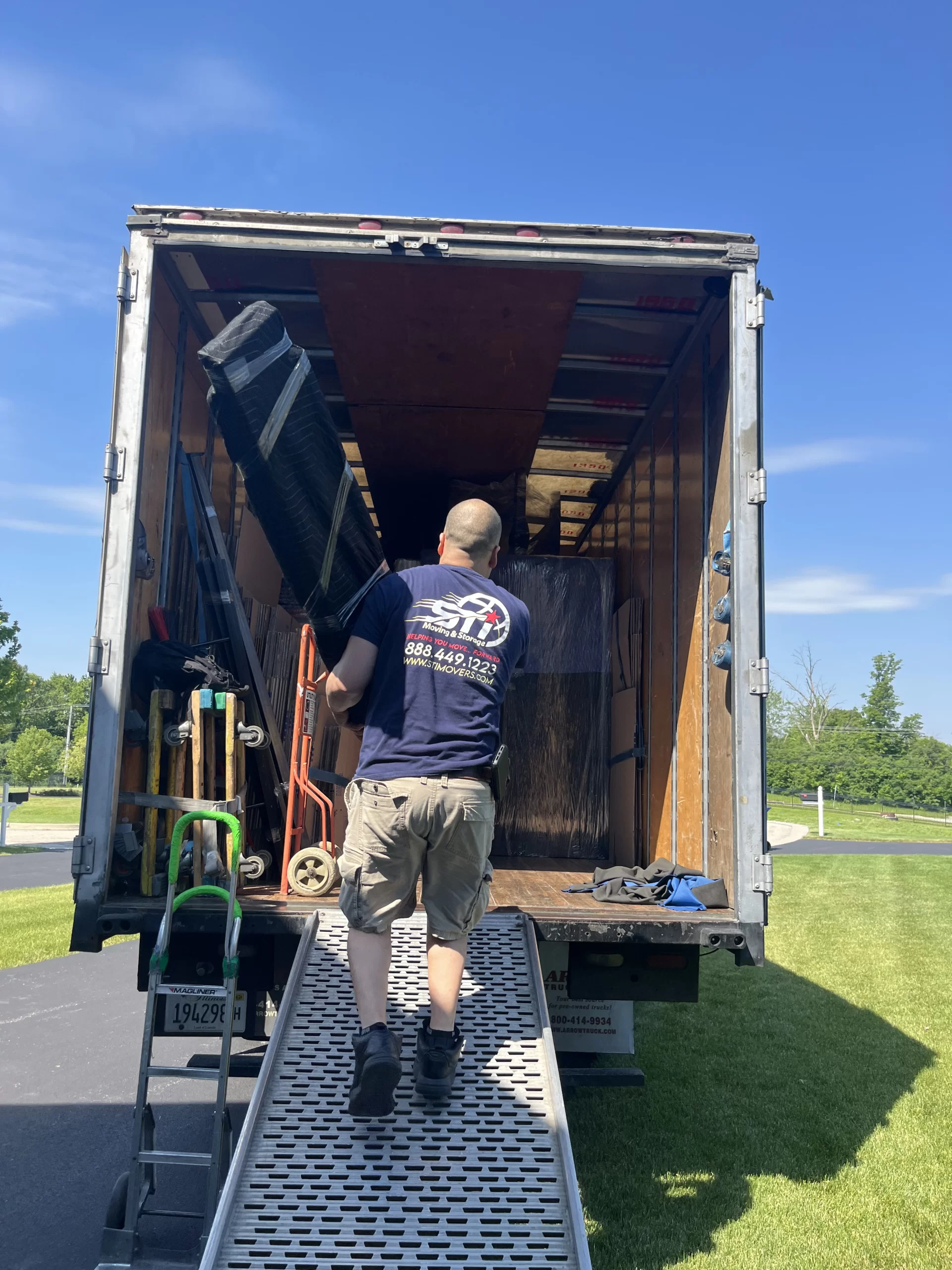 Great Lakes IL movers loading furniture in North Chicago apartment scaled
