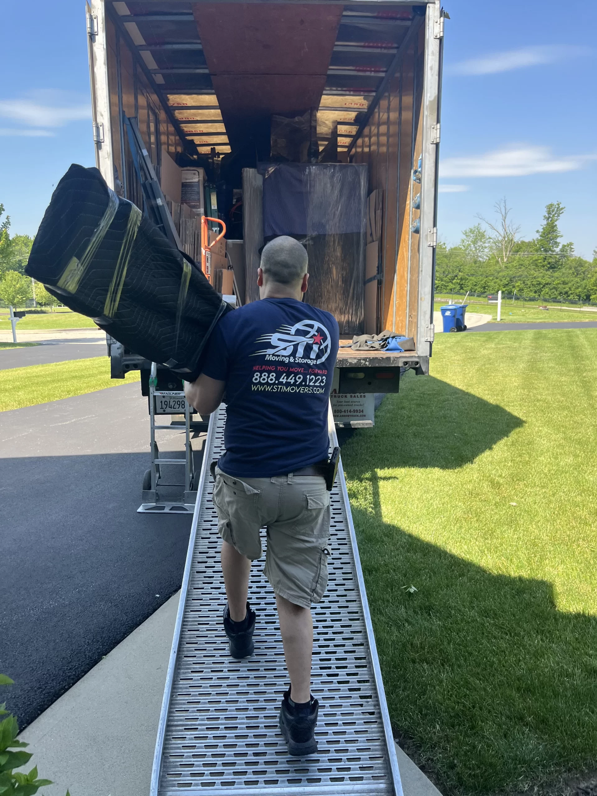 Island Lake movers loading boxes on Eastway Drive